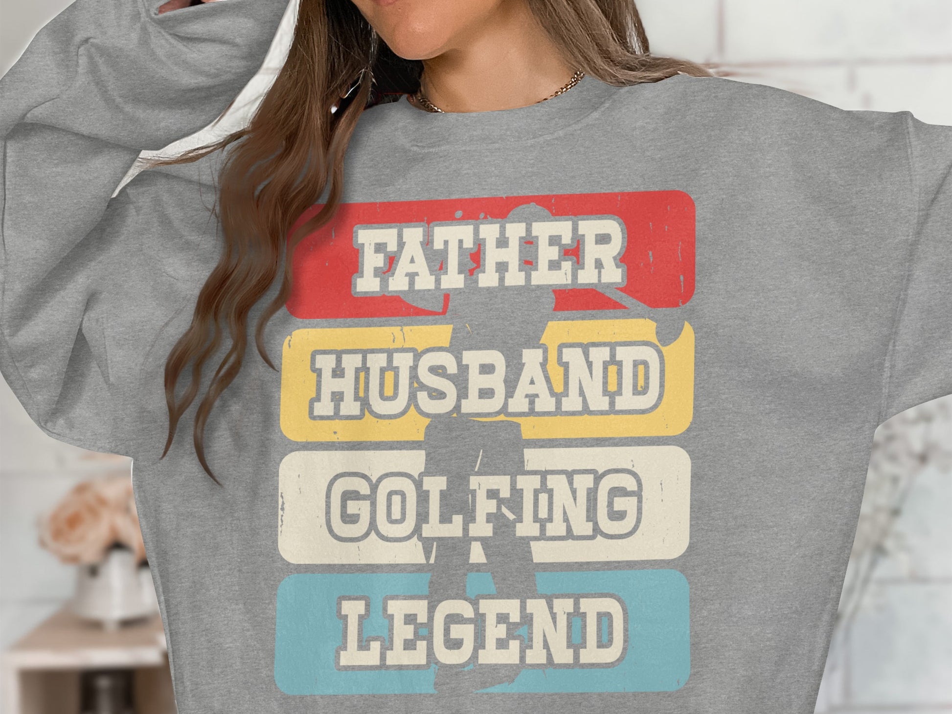 Grey sweatshirt with "Father Husband Golfing Legend" text over a golfer silhouette.