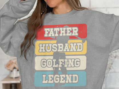 Grey sweatshirt with "Father Husband Golfing Legend" text over a golfer silhouette.