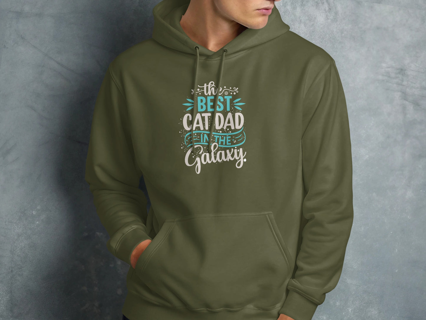 Green hoodie with "The best cat dad in the galaxy" text.