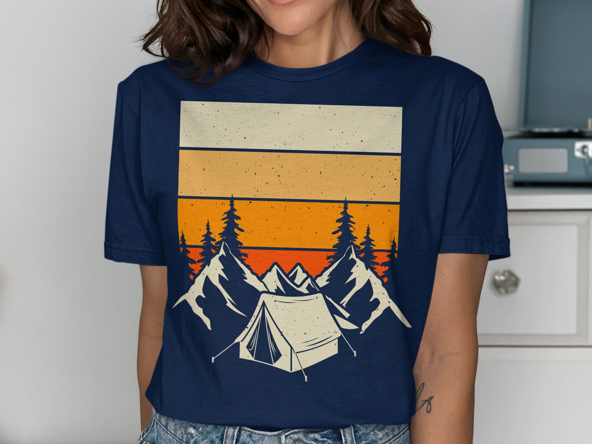 Navy t-shirt with retro mountain tent and tree graphic design.