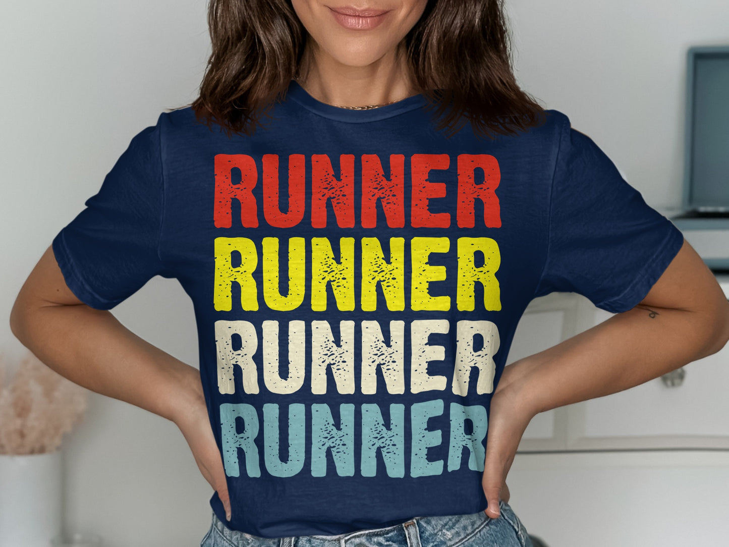 Navy t-shirt with stacked "RUNNER" text in red, yellow, cream, and blue.