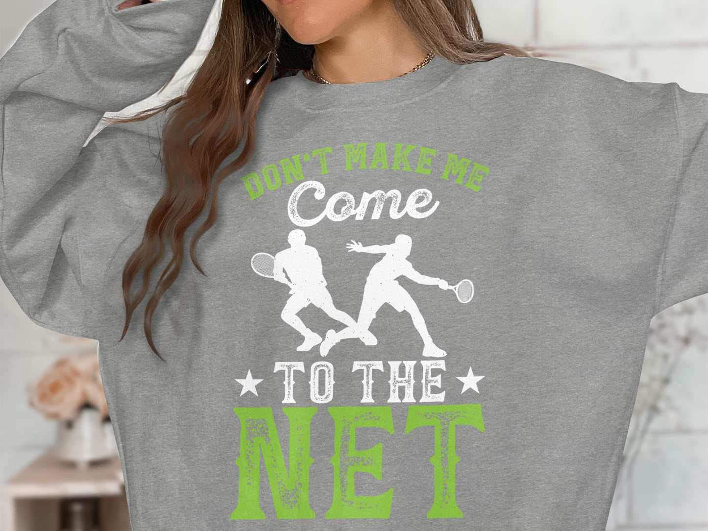 Grey sweatshirt with text "Don't Make Me Come to the Net" and two tennis players.