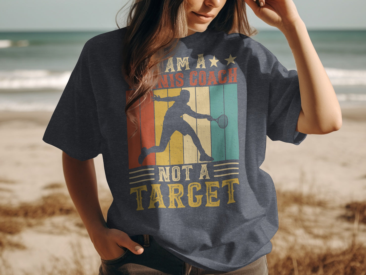 T-shirt with retro graphic of a tennis player and text "I AM A TENNIS COACH NOT A TARGET".