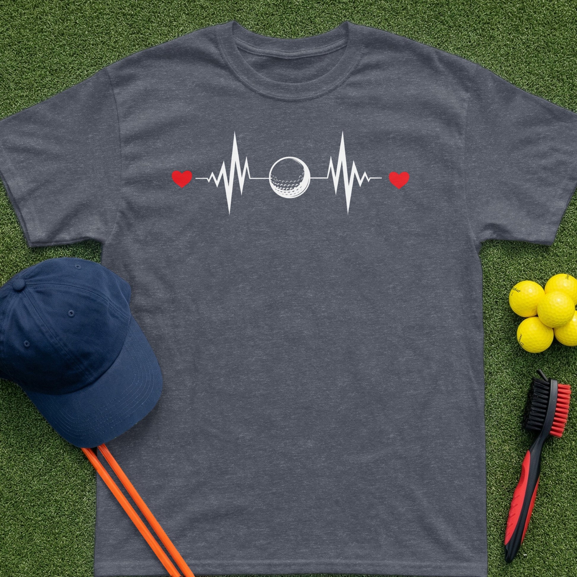 Dark grey t-shirt with a golf ball heartbeat graphic, red hearts, and golf accessories.