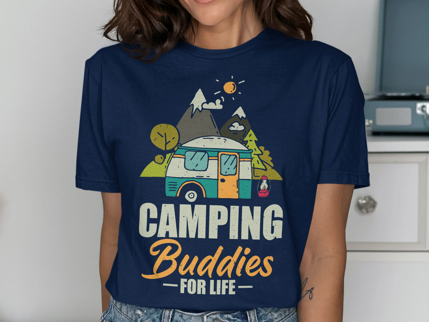 Navy t-shirt with graphic of a camper van, mountains, and "CAMPING Buddies FOR LIFE" text.