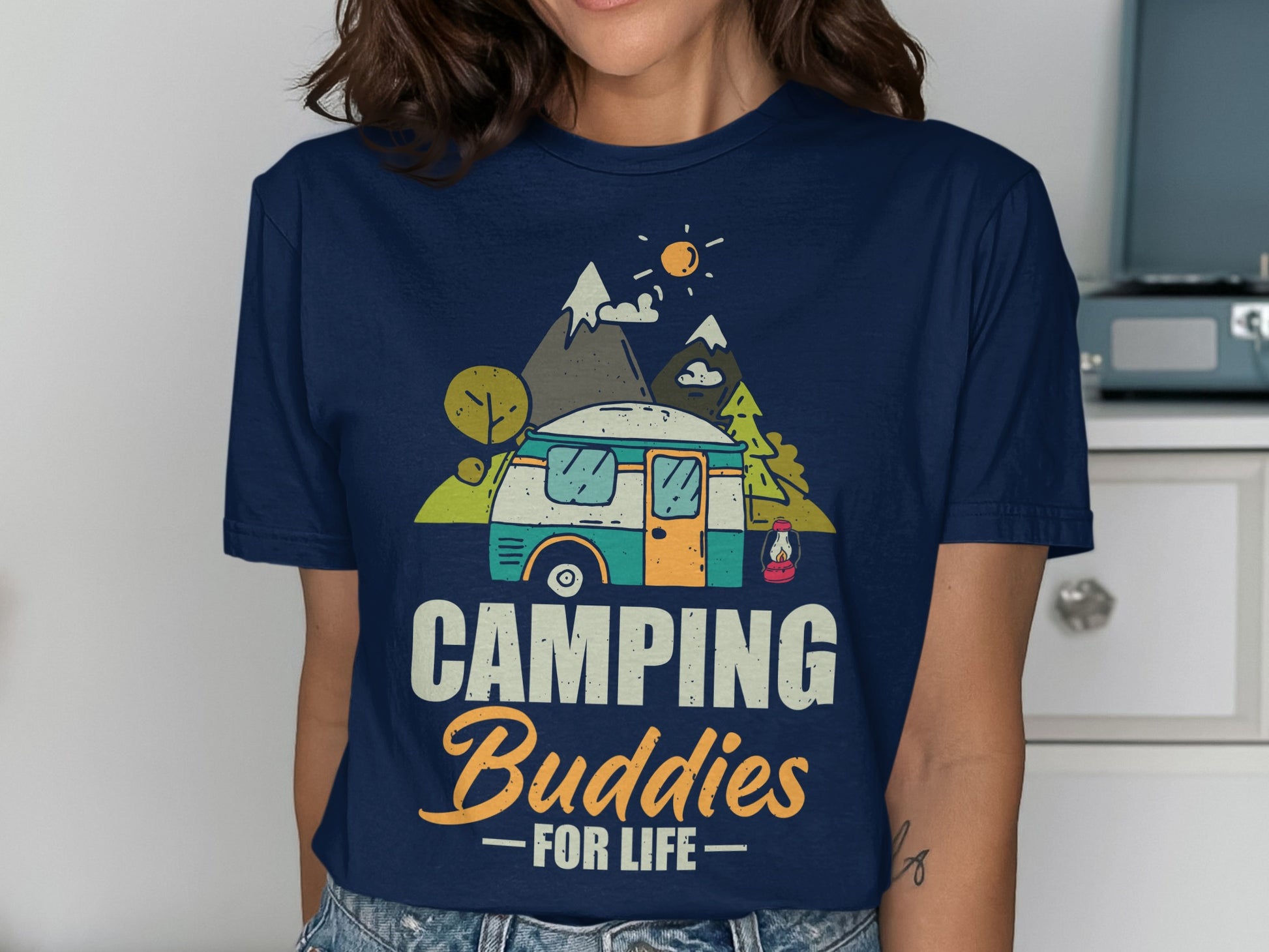 Navy t-shirt with graphic of a camper van, mountains, and "CAMPING Buddies FOR LIFE" text.