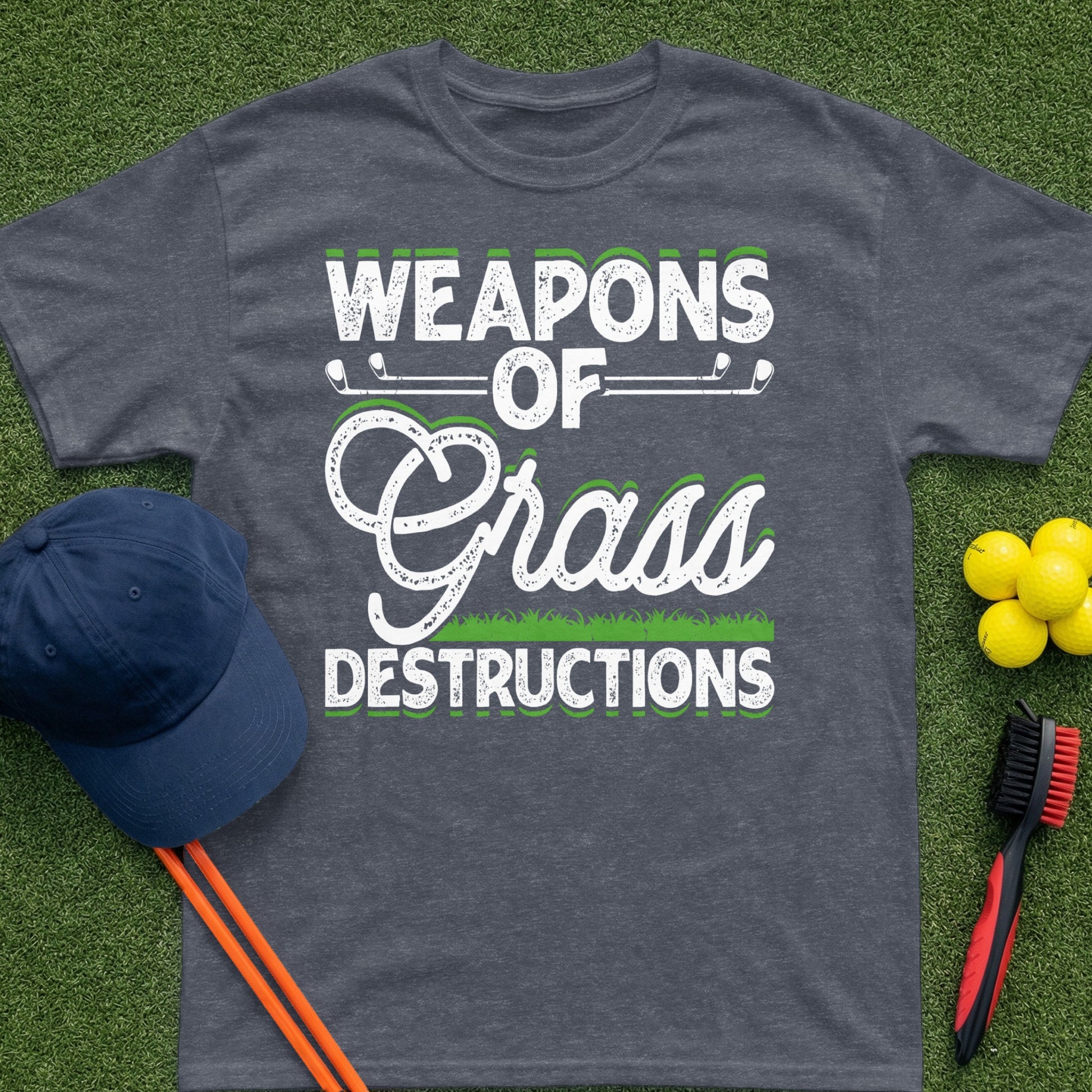 Dark grey t-shirt with "Weapons of Grass Destructions" text and golf accessories.