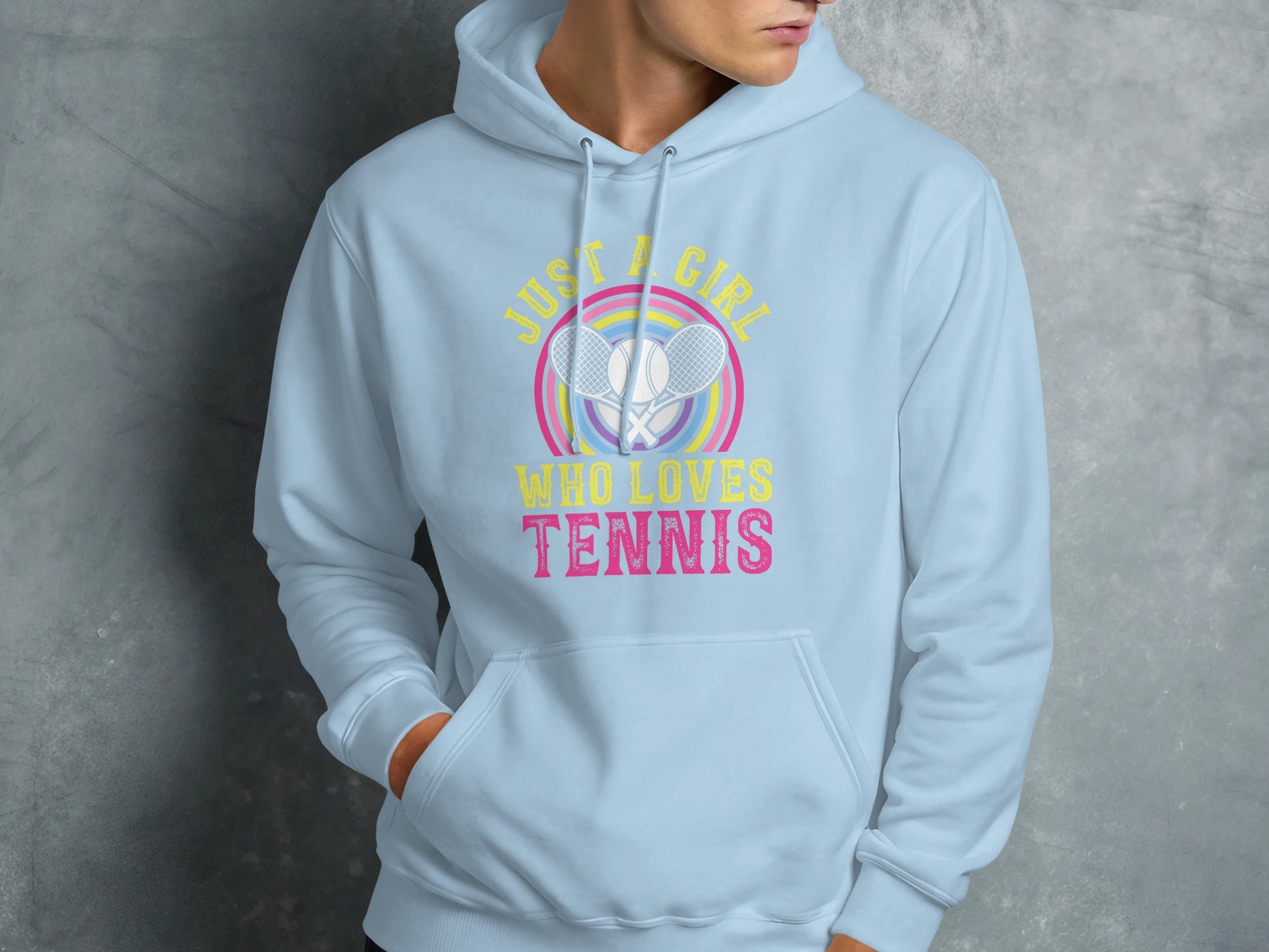Light blue hoodie with "Just a girl who loves tennis" graphic and crossed tennis rackets.