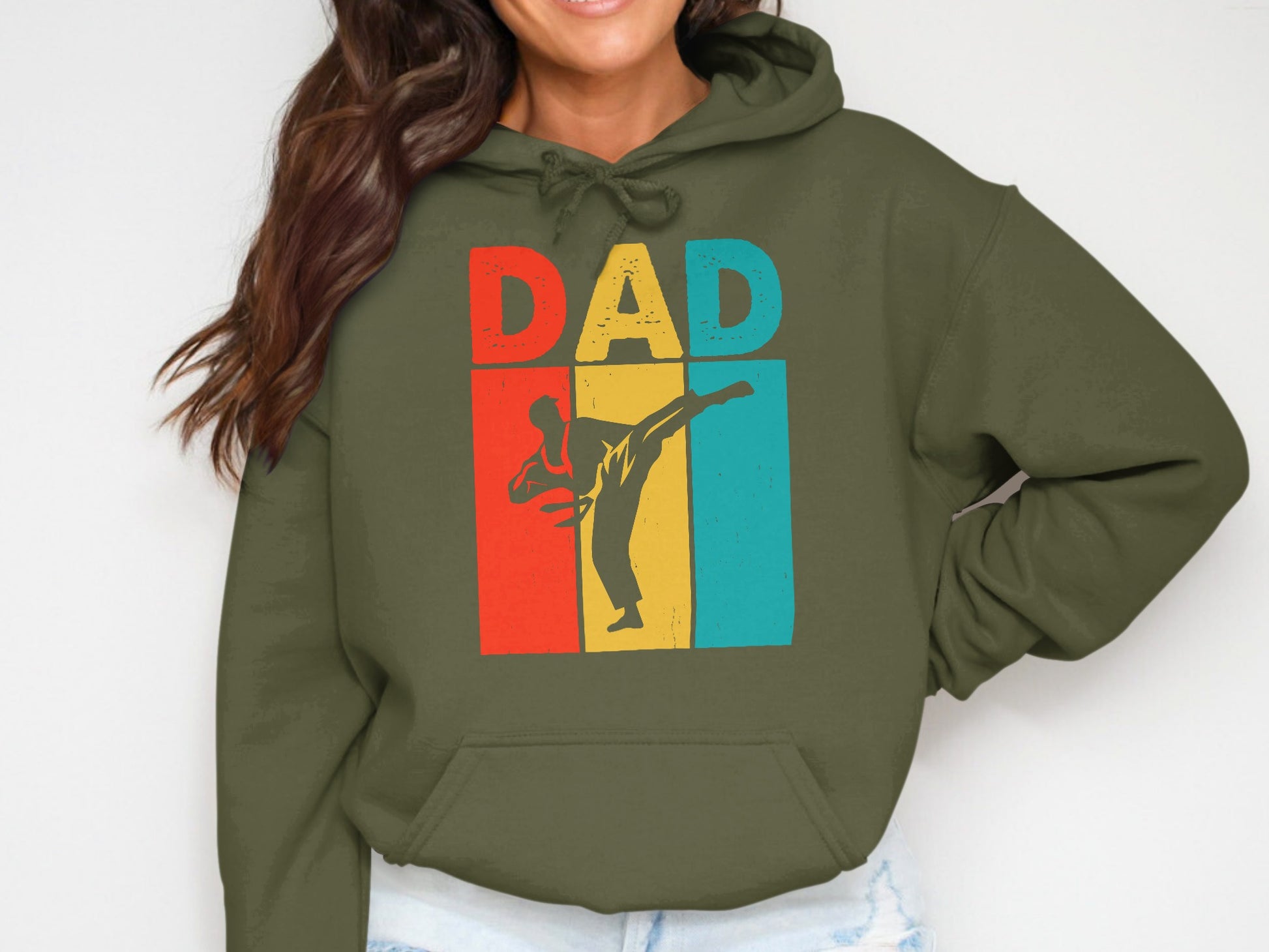 Olive green hoodie with "DAD" text and a silhouette of a martial artist.