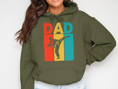 Olive green hoodie with "DAD" text and a silhouette of a martial artist.