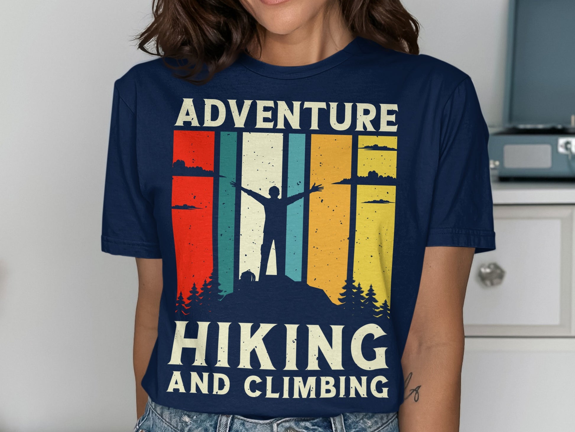 Navy t-shirt with mountain hiker silhouette, "Hiking and Climbing" text.