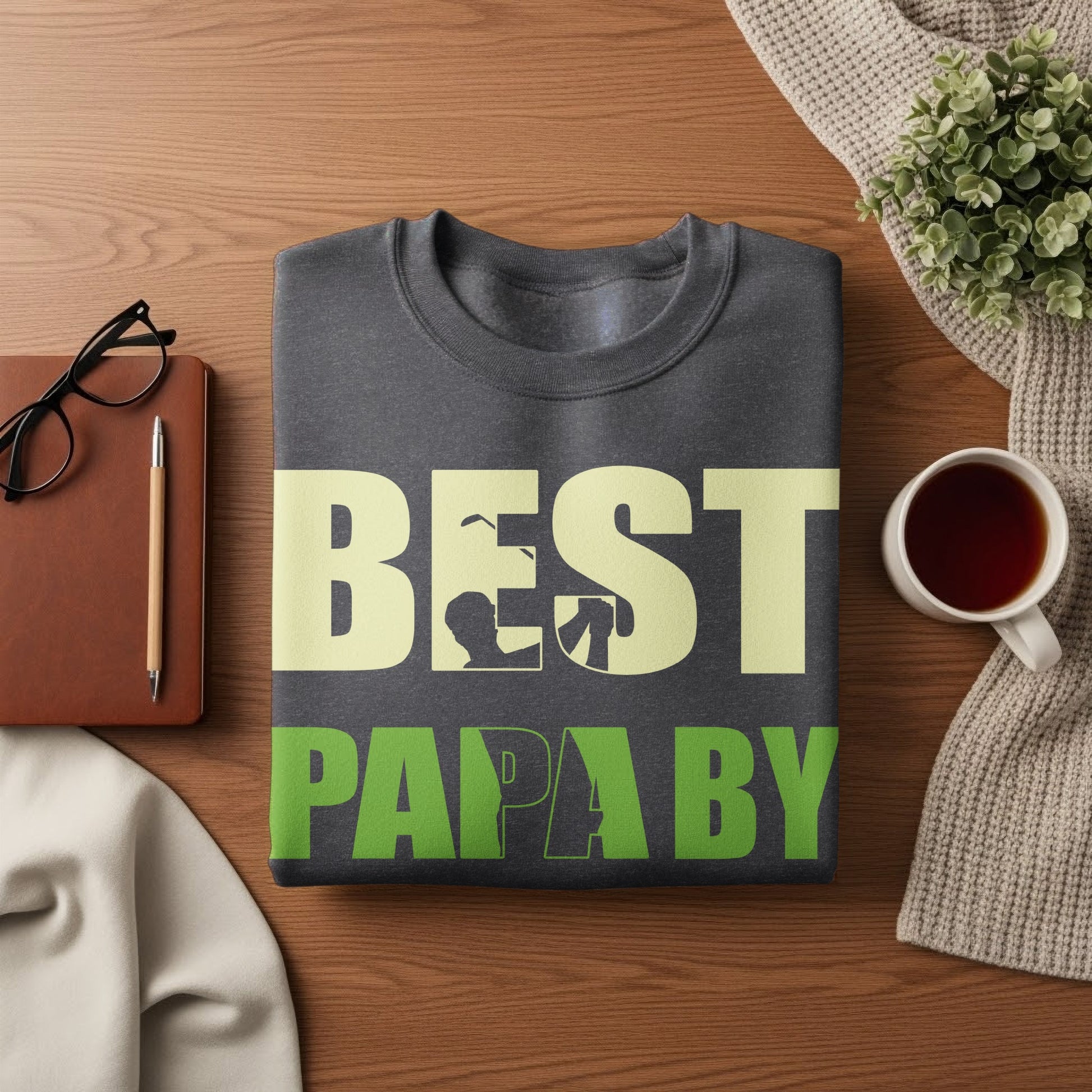 Dark gray sweatshirt with "BEST PAPA BY" text in beige and green.