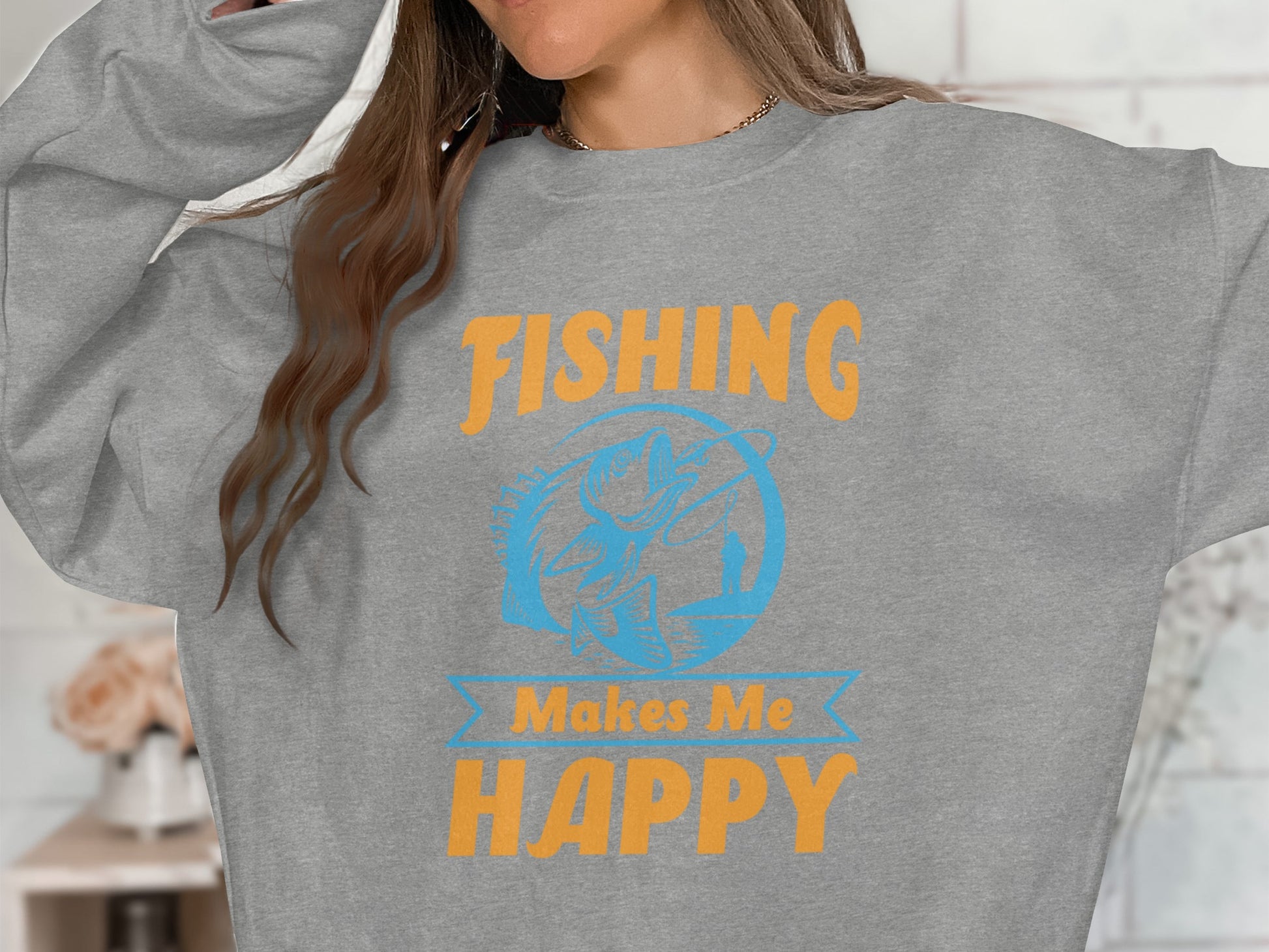 Grey sweatshirt with "FISHING MAKES ME HAPPY" text and fish graphic.