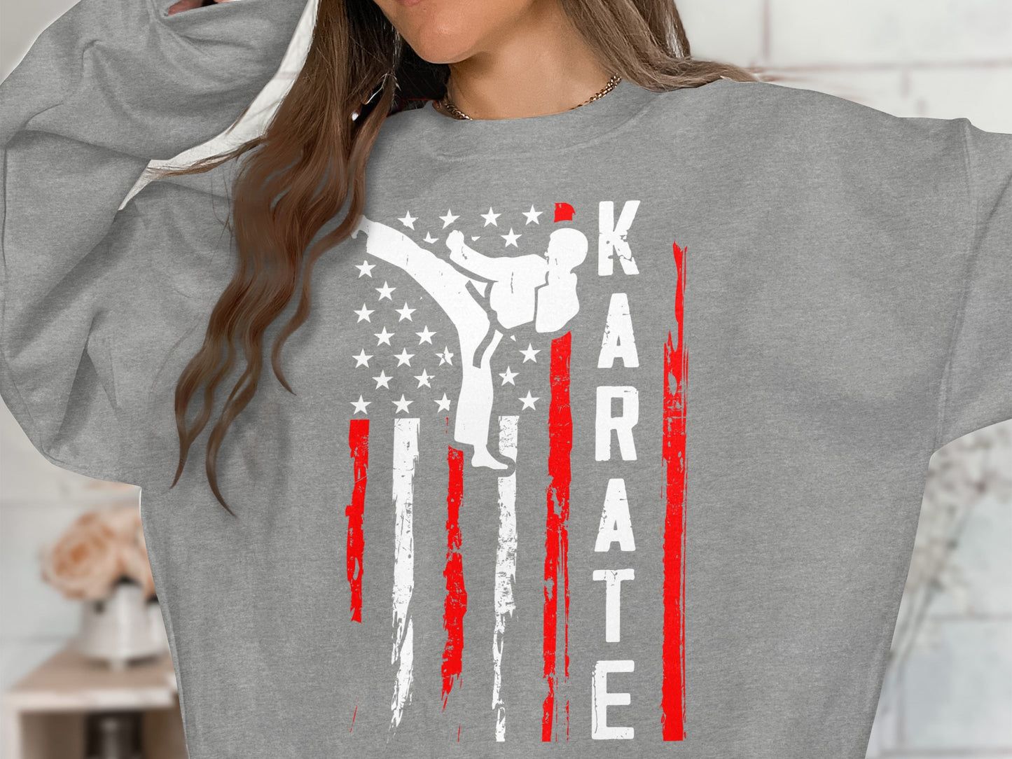 Gray sweatshirt with a white karate fighter silhouette on a distressed American flag design.