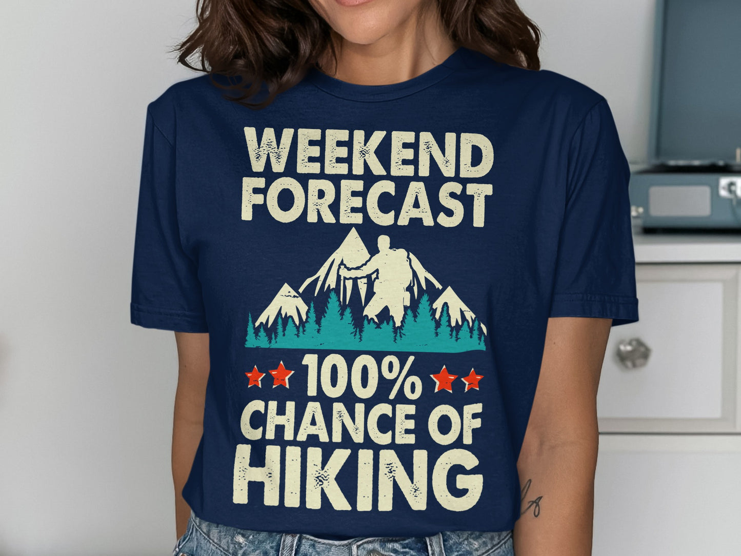 Navy t-shirt with "Weekend Forecast: 100% Chance of Hiking" text and mountain graphic.