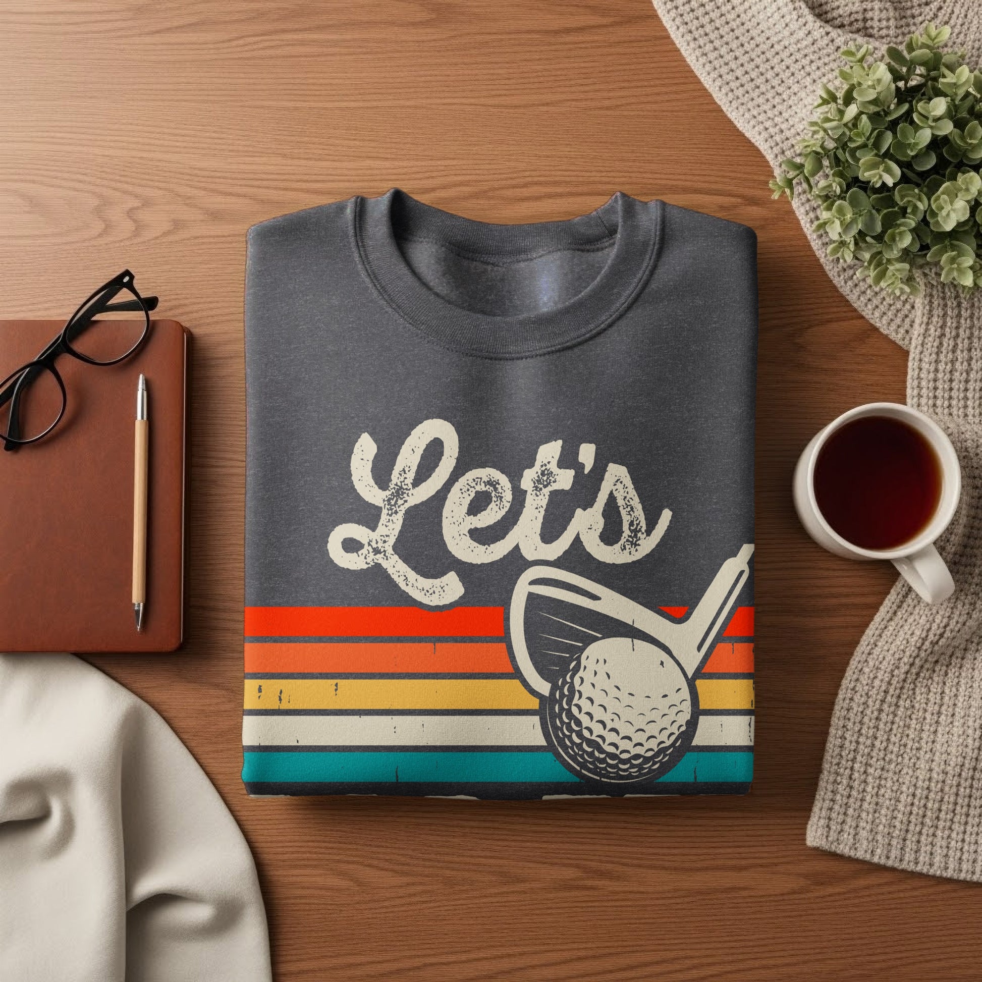 Dark gray sweatshirt with "Let's" and a golf ball and club graphic.