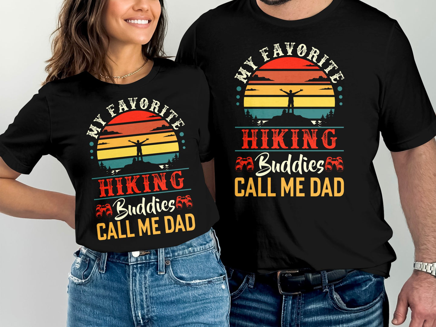 T-shirts with "My Favorite Hiking Buddies Call Me Dad" text and sunset hiking graphic.