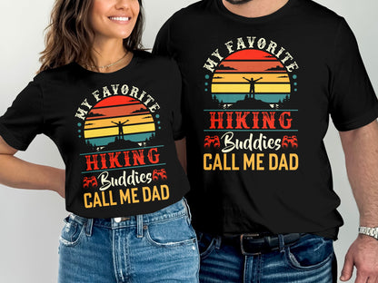 T-shirts with "My Favorite Hiking Buddies Call Me Dad" text and sunset hiking graphic.