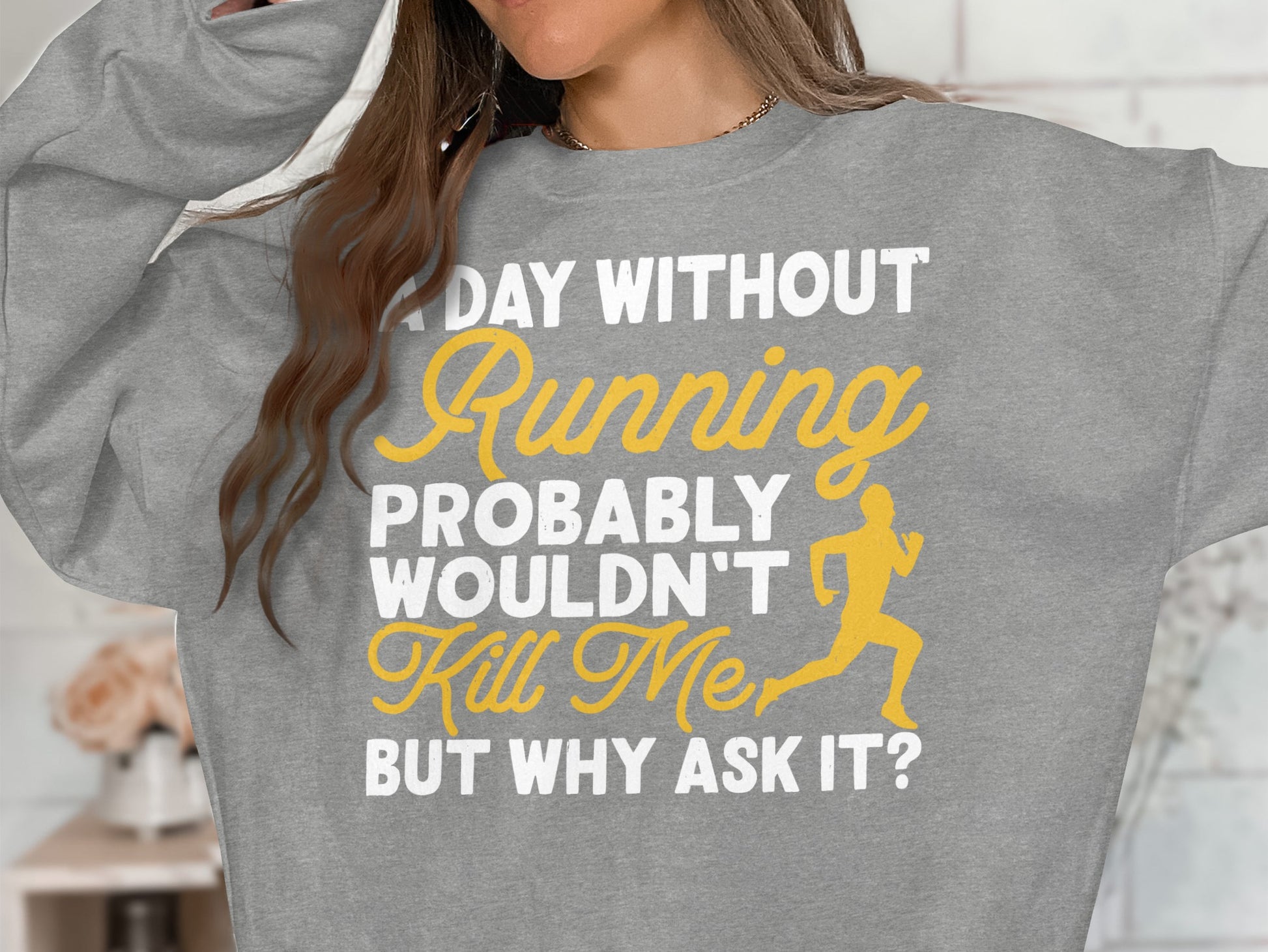 Grey sweatshirt with "A Day Without Running Wouldn't Probably Kill Me, But Why Ask It?" text.