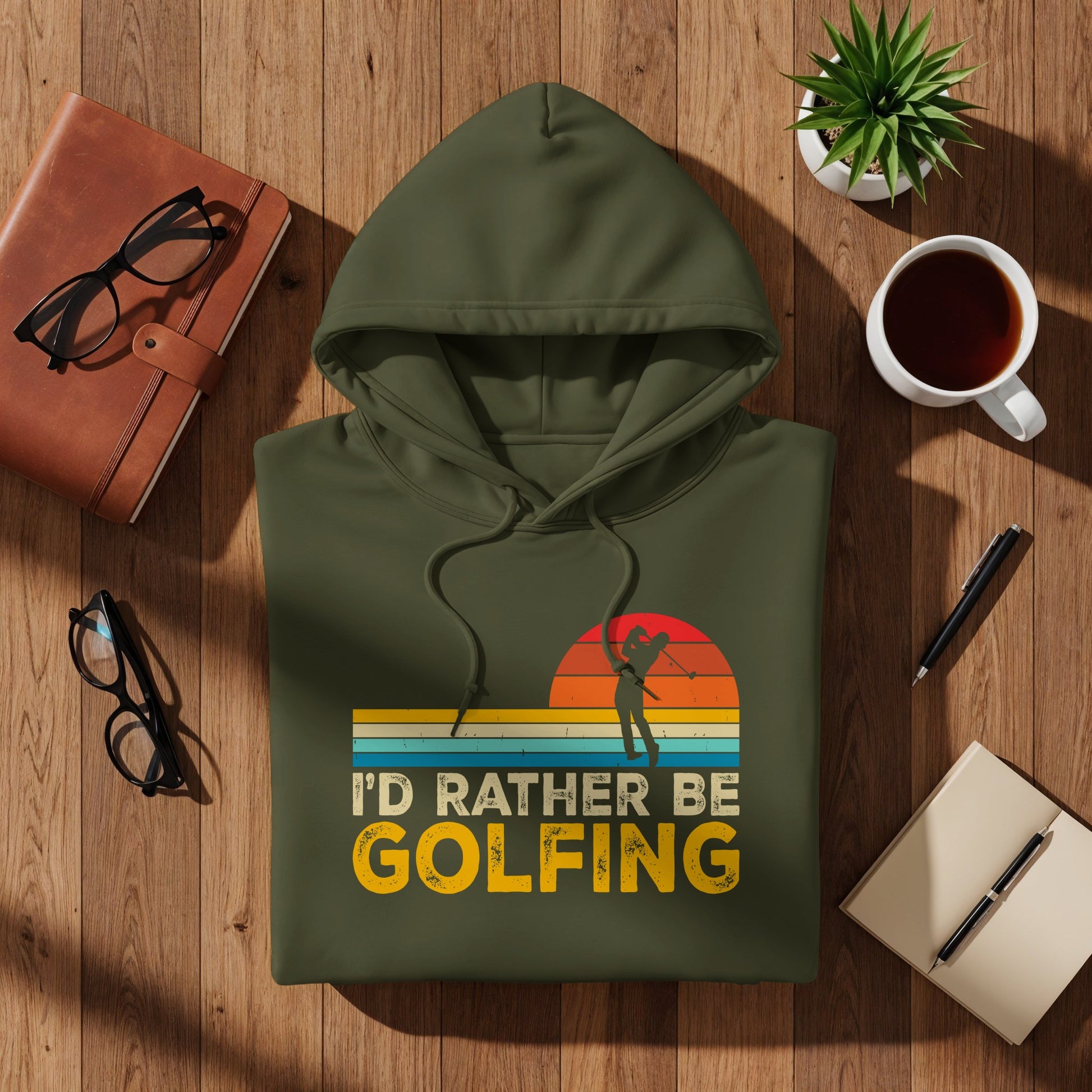 Olive green hoodie with "I'd Rather Be Golfing" text and golfer graphic.