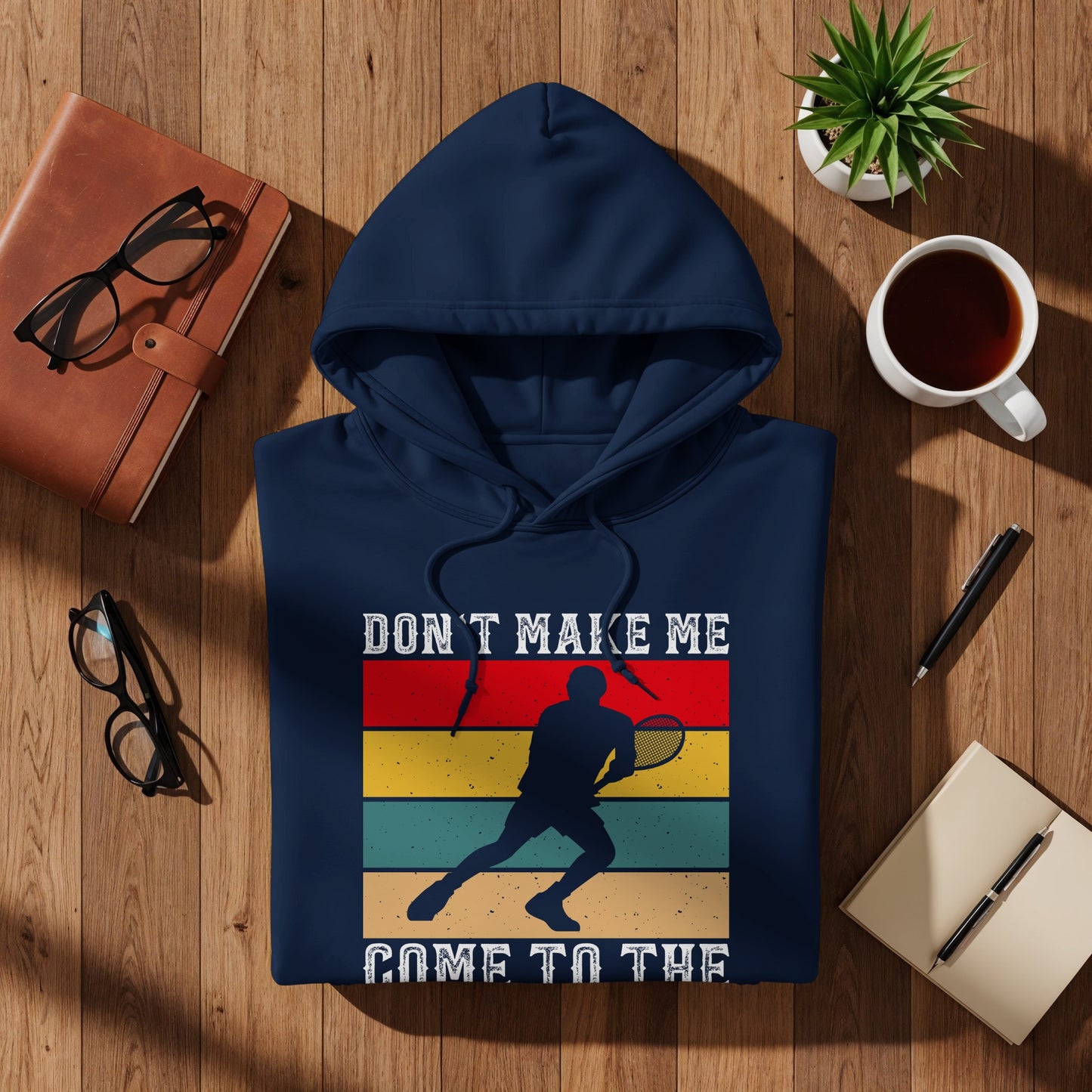 Navy hoodie with vintage tennis player graphic and text.