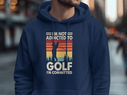 Navy hoodie with "I'm Not Addicted To Golf I'm Committed" text and golfer graphic.