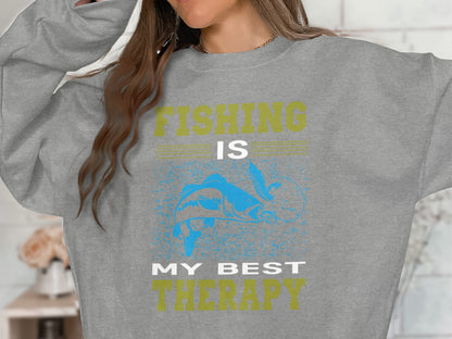 Grey sweatshirt with "Fishing is my best therapy" and fish graphic.