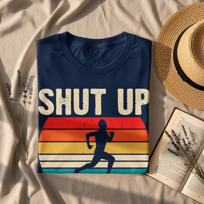 Navy t-shirt with "Shut Up" slogan and runner silhouette against a sunset graphic.
