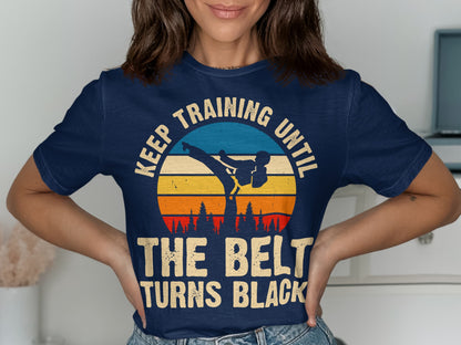 Navy t-shirt with vintage sunset graphic and text: "Keep training until the belt turns black."