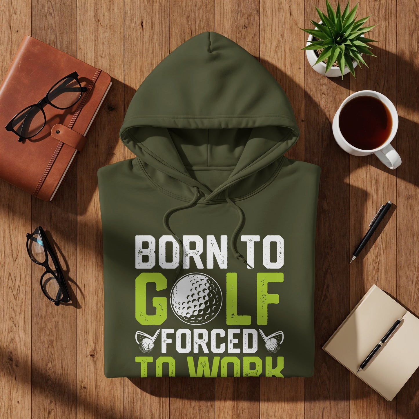 Olive green hoodie with "Born to Golf Forced to Work" text and golf ball graphic.