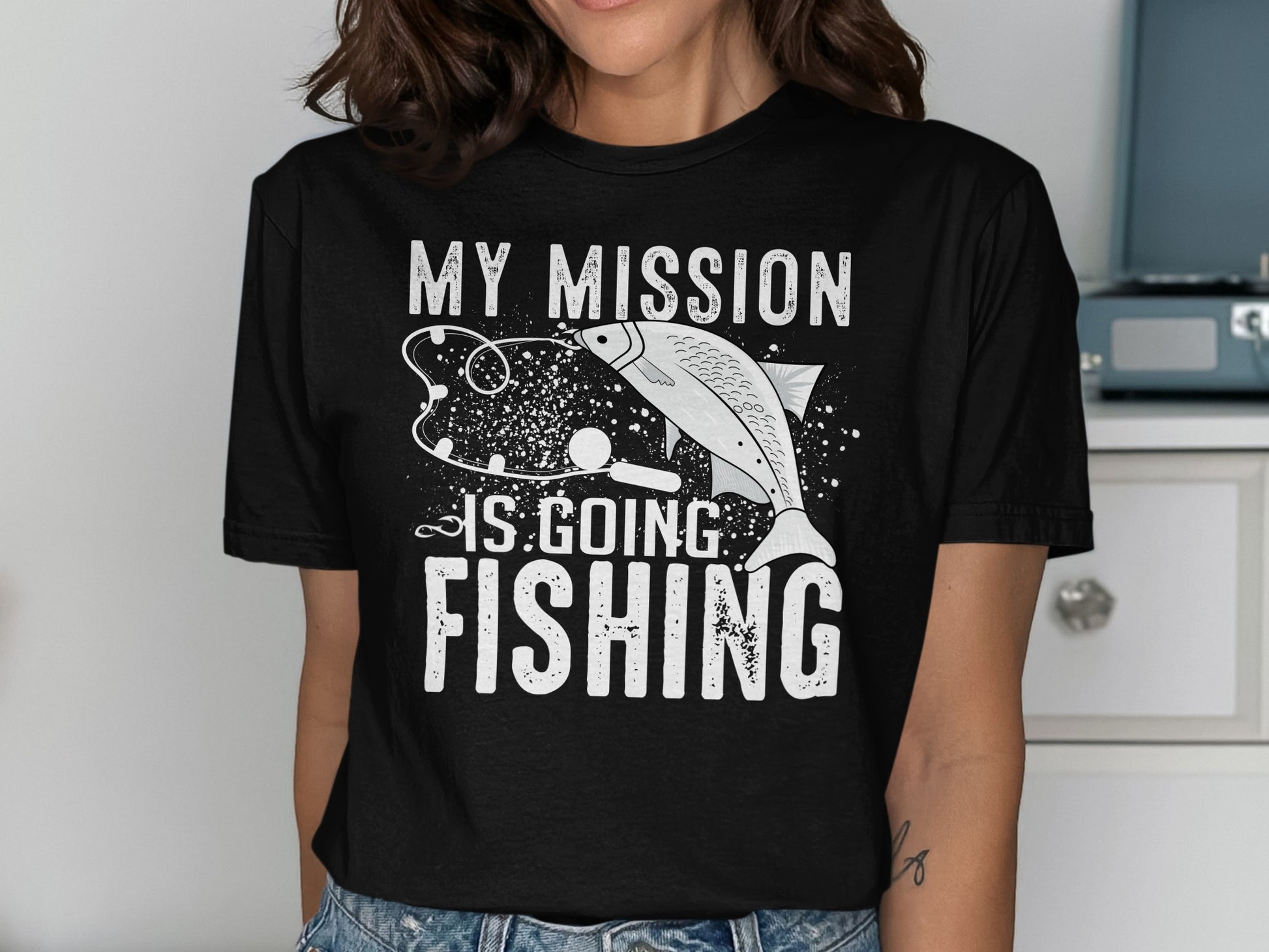 Black t-shirt with white text and graphics reading "My Mission Is Going Fishing."