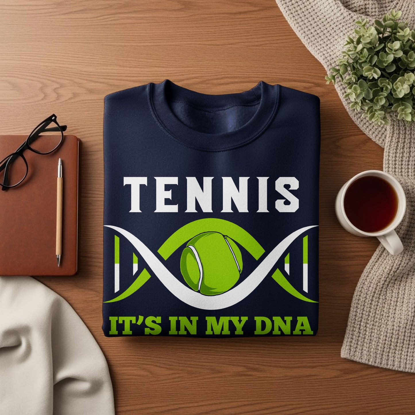 Navy sweatshirt with "TENNIS IT'S IN MY DNA" and a tennis ball DNA graphic.