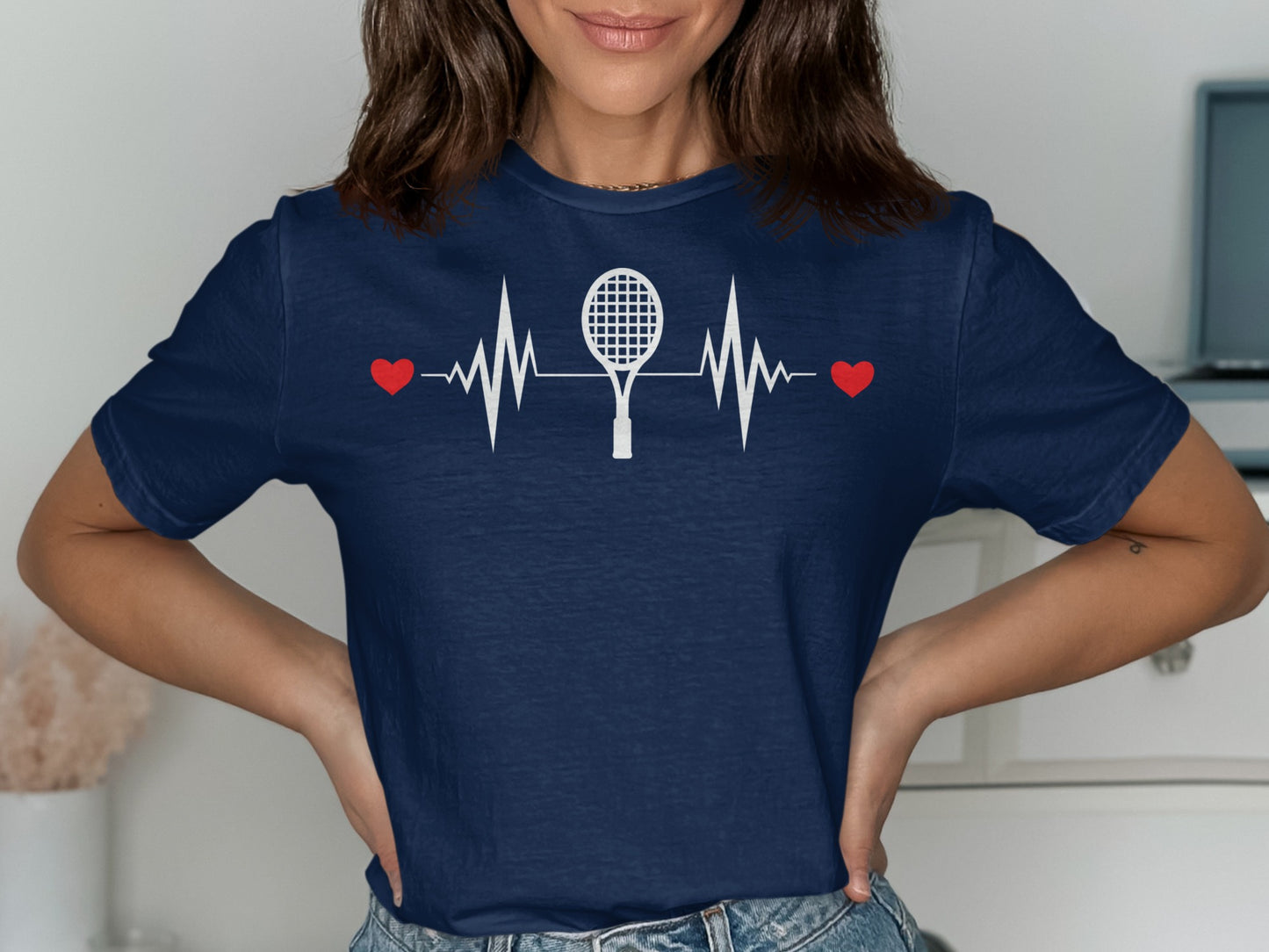 Navy t-shirt with white tennis racket, heart, and EKG graphic.