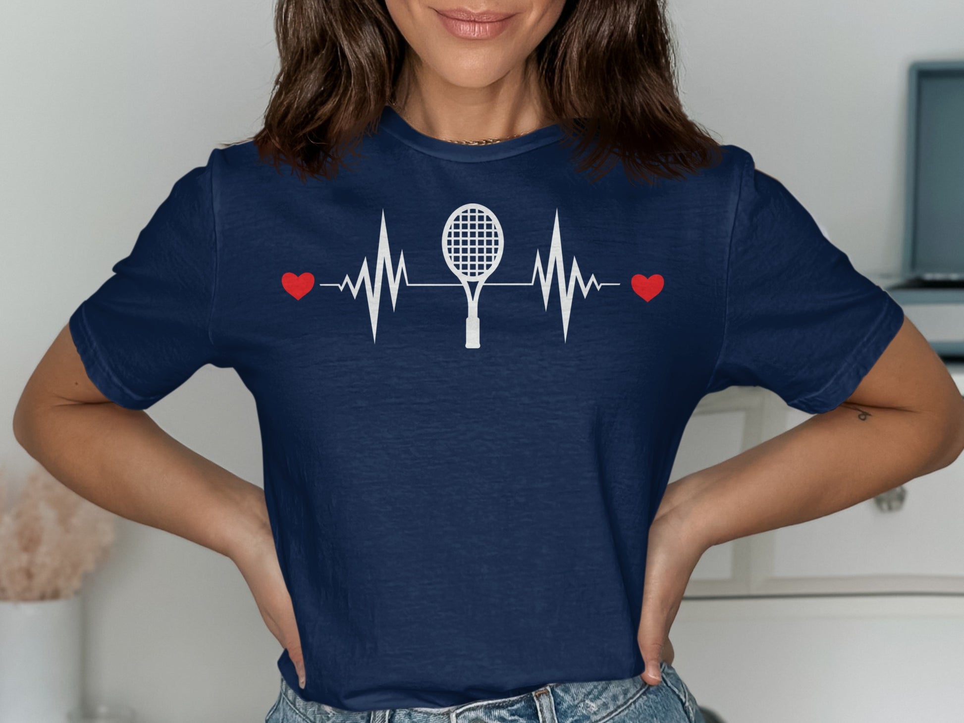 Navy t-shirt with white tennis racket, heart, and EKG graphic.
