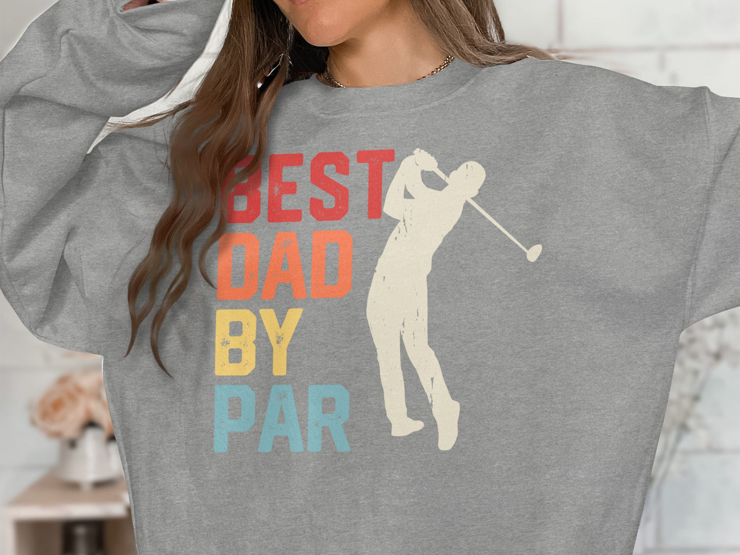 Gray sweatshirt with "BEST DAD BY PAR" text and golfer graphic.