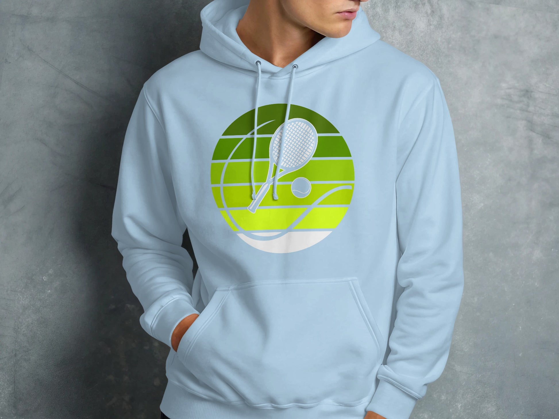 Light blue hoodie with a circular tennis graphic featuring a racket, ball, and court lines.