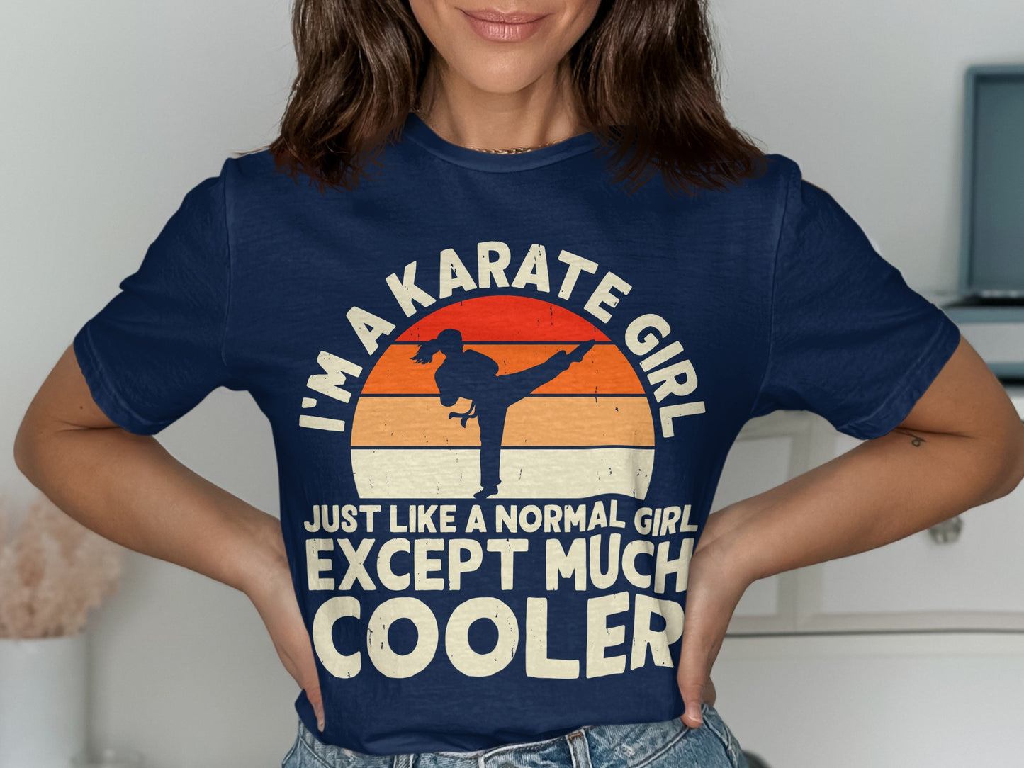 Navy t-shirt with "I'm a karate girl just like a normal girl except much cooler" text and graphic.