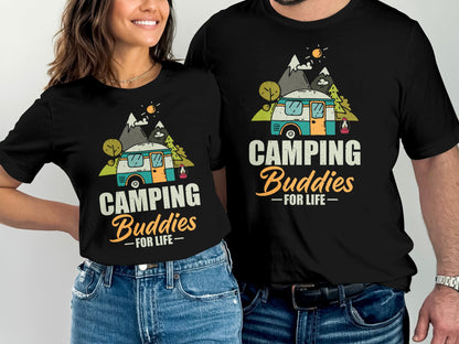 Two people wearing matching black t-shirts with a camper and mountains design.