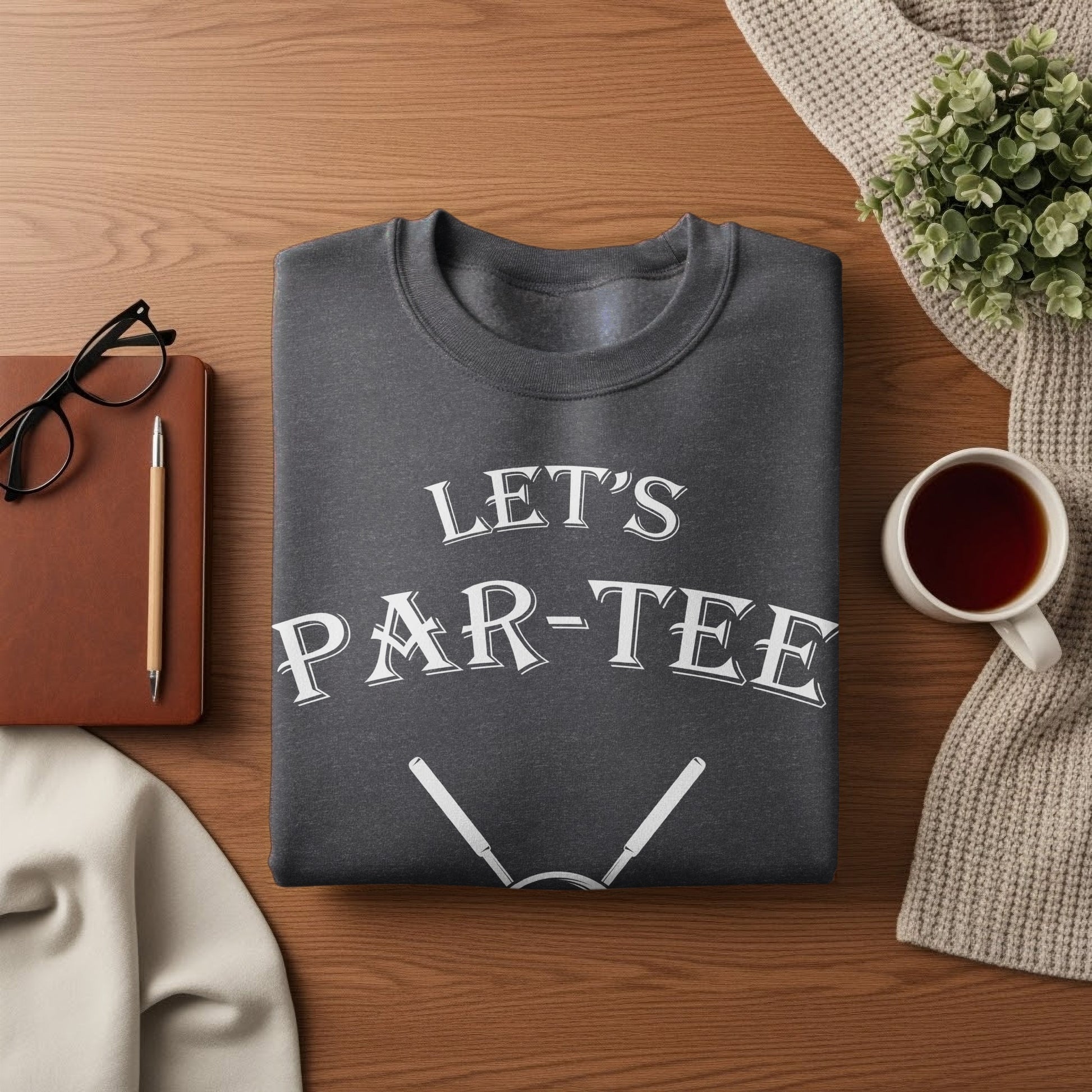 Dark gray sweatshirt with "Let's PAR-TEE" text and golf tees.