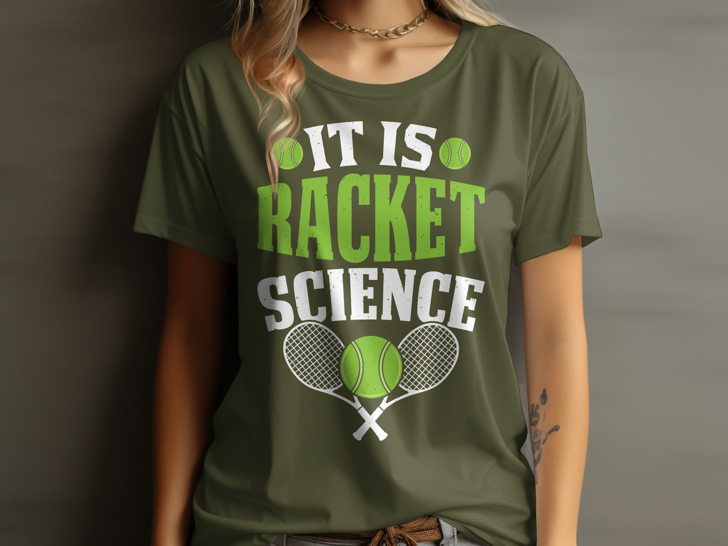 Green t-shirt with "It is racket science" and tennis rackets and balls.