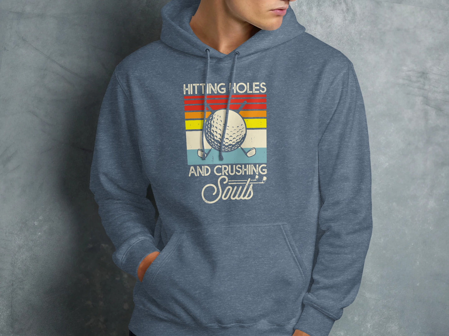 Gray hoodie with "Hitting Holes and Crushing Souls" text and golf ball graphic.
