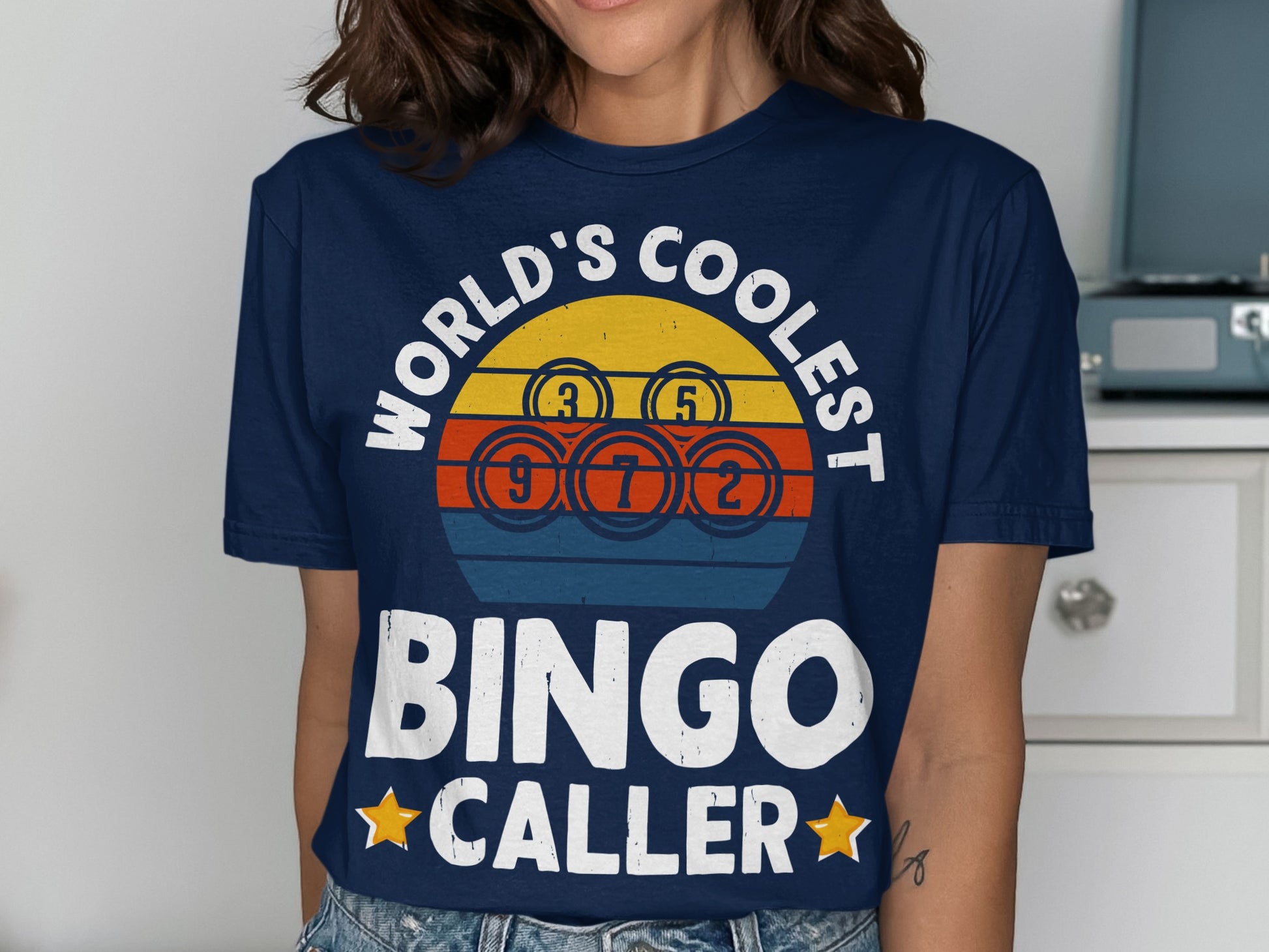 Navy t-shirt with "World's Coolest Bingo Caller" and bingo balls.