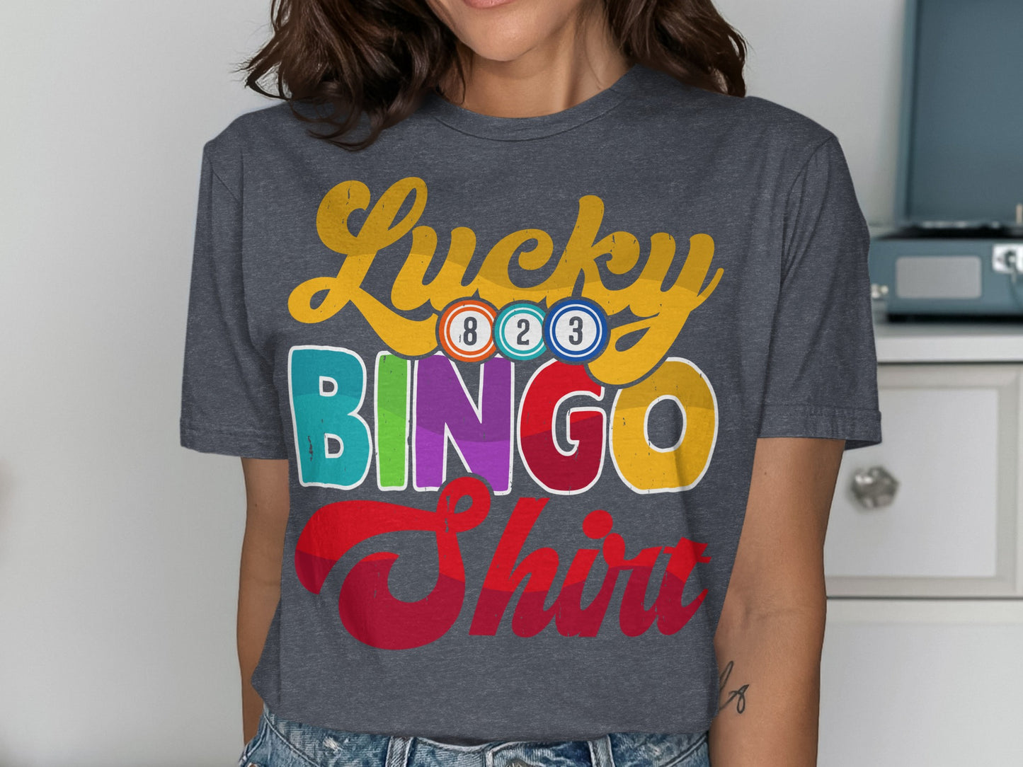Dark gray t-shirt with "Lucky Bingo Shirt" text and colorful bingo balls.