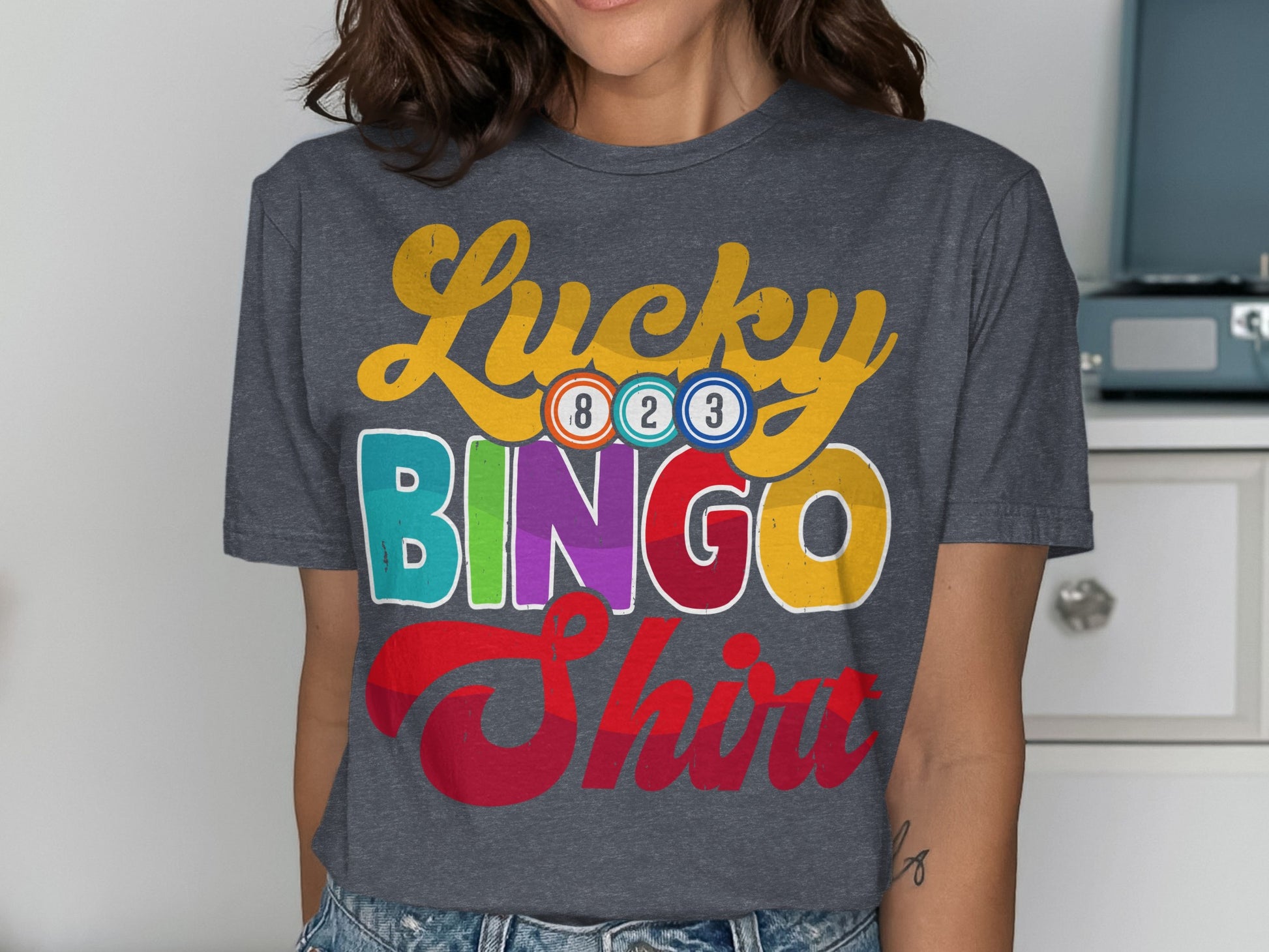 Dark gray t-shirt with "Lucky Bingo Shirt" text and colorful bingo balls.