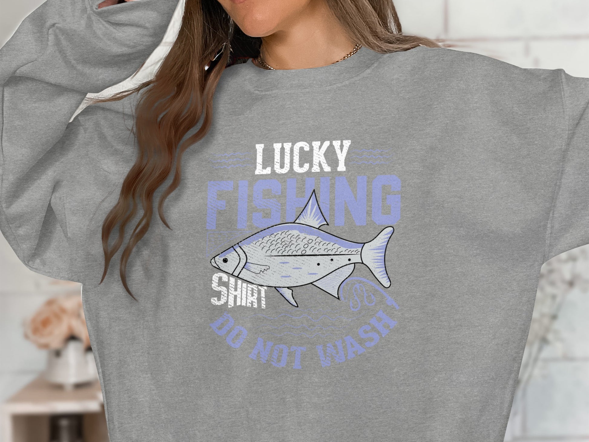 Gray sweatshirt with "Lucky Fishing Shirt" and fish graphic.