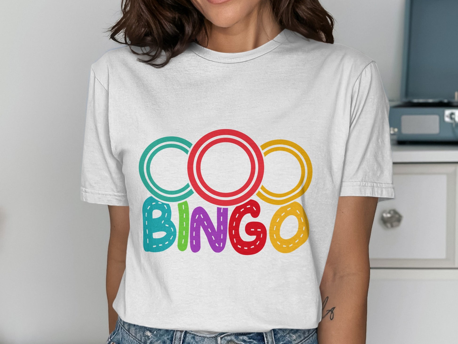White t-shirt with colorful "BINGO" text graphic.
