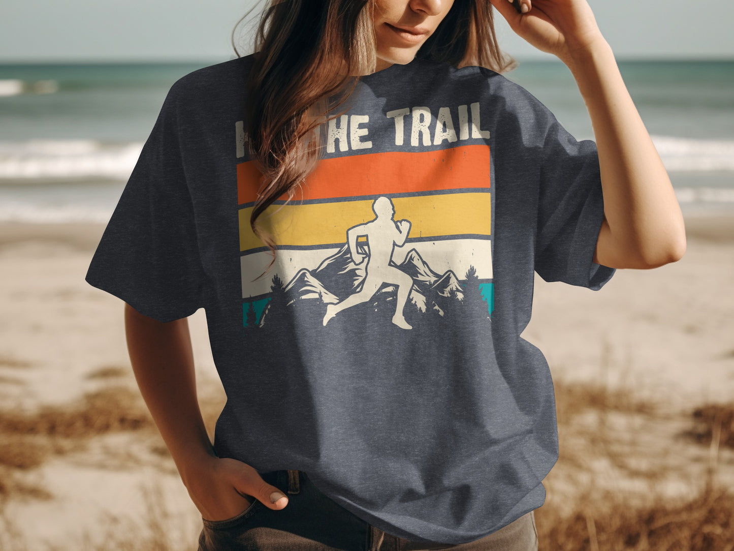 Running silhouette on vintage striped mountain graphic on dark t-shirt.