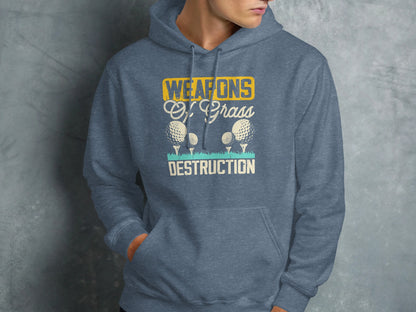 Blue hoodie with "Weapons of Grass Destruction" text and golf balls.
