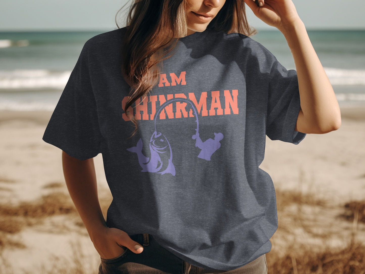 Dark t-shirt with "I AM FISHERMAN" text and a fishing graphic on a person.