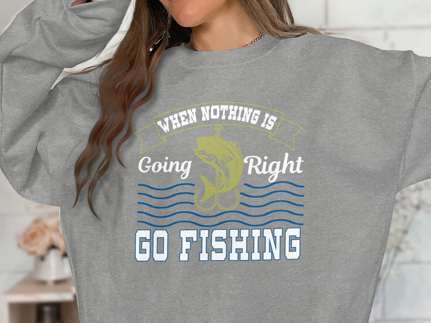 Gray sweatshirt with "When Nothing Is Going Right, Go Fishing" and a fish graphic.